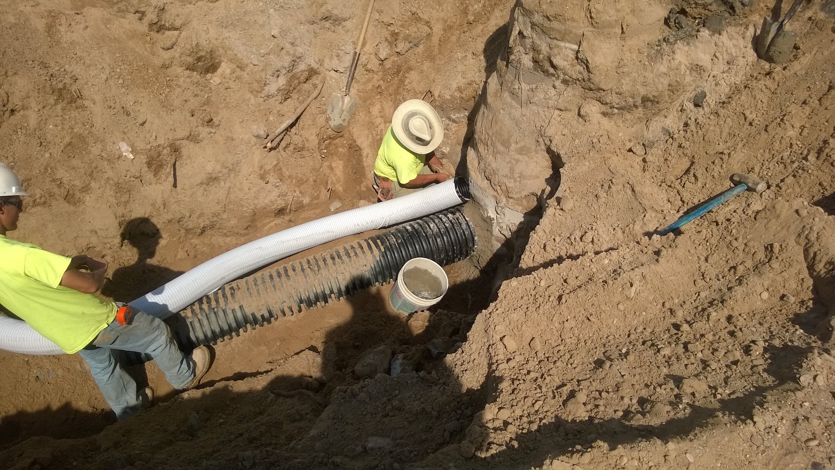 Drainage pipe installation in excavated trench — culvert replacement and erosion control on the Cory Bishop Drain project